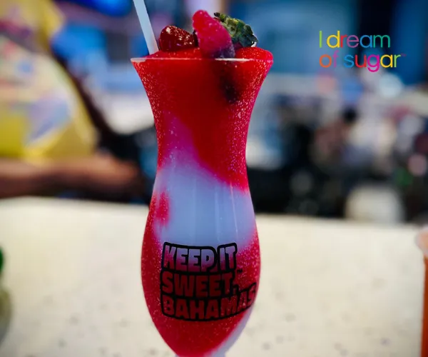 A layered red and white frozen milkshake